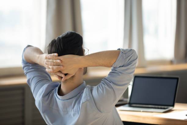 istock Rear view employee take break during workday in modern office 1306230764