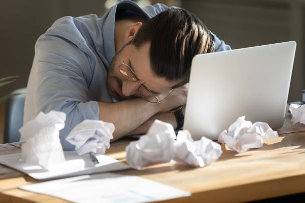 istock Overworked employee fell asleep in the office 1306230777