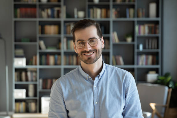 istock Portrait professional employee worker posing for camera at modern office 1306230801