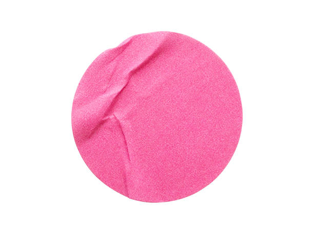 istock Blank pink round adhesive paper sticker label isolated on white background 1306230842
