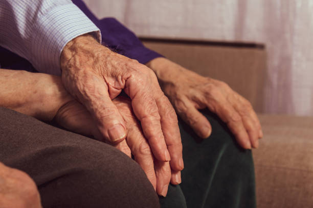 istock Senior's hand cover wife's hand for support. 1306231794