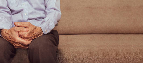 istock Unrecognizable caucasian old man sitting on sofa. 1306231795