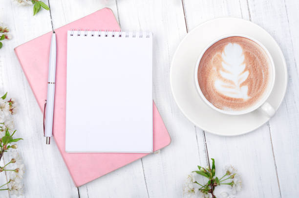 istock Creative flat lay of workspace desk, notepad on wooden background 1306236260