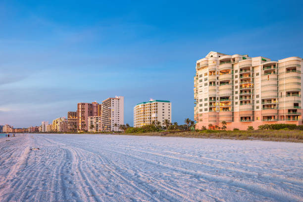 Marco Island Beach Naples Florida USA Beach with condos and hotels on Marco Island, Naples, Florida, USA in the evening. marco island stock pictures, royalty-free photos & images