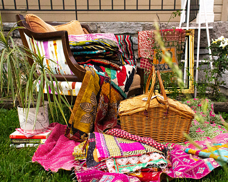 Bohemian outdoor picnic basket and chair with plants