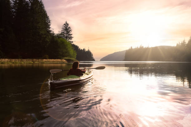 istock Adventurous Girl kayaking in the Pacific Ocean. 1306238222
