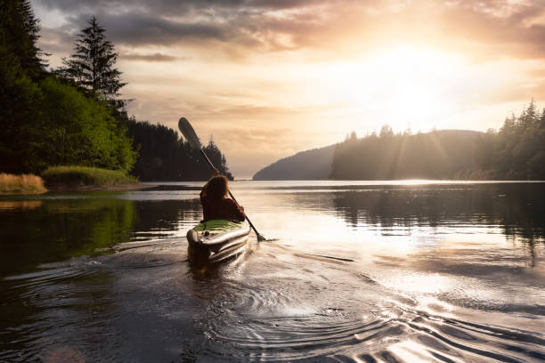 istock Adventurous Girl kayaking in the Pacific Ocean. 1306238224