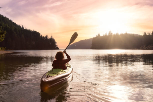 istock Adventurous Girl kayaking in the Pacific Ocean. 1306238226