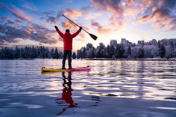 istock Adventurous male is paddle boarding near Stanley Park 1306238230