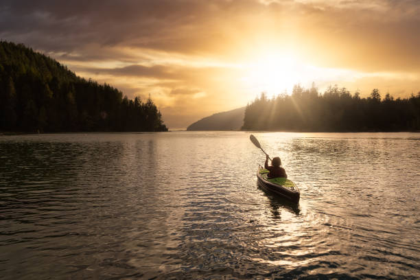 istock Adventurous Girl kayaking in the Pacific Ocean. 1306238241