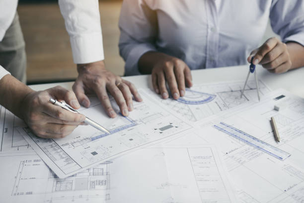 istock The partnership engineering man or co-workers working on a project and discussing together with looking at blueprint paperwork. 1306238938