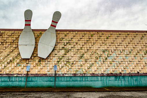 March 1, 2021 - Nashville, Tennessee, U.S.: Two giant bowling pins affixed to the outside of the dilapidated and boarded up Madison Bowling alley.
