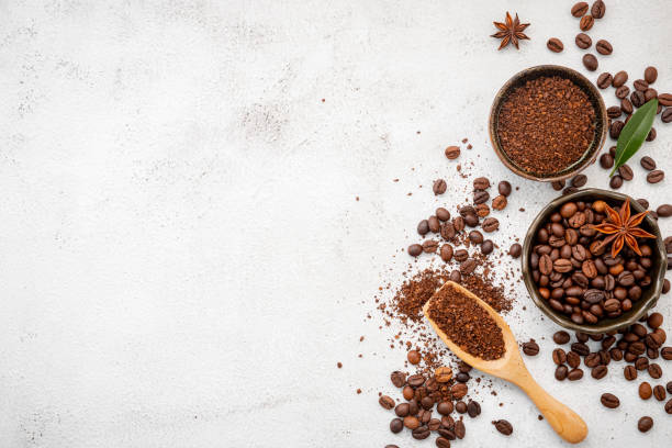 istock Background of various coffee , dark roasted coffee beans , ground and capsules with scoops setup on white concrete background with copy space. 1306240112