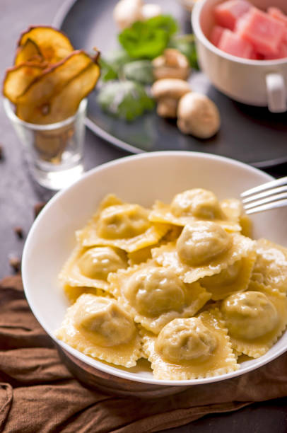 istock ravioli with spinach and ricotta cheese on a wooden table 1306243634