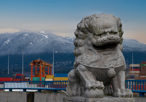 Vancouver,BC, Canada. November,2020. North shore mountains guarded by statue.