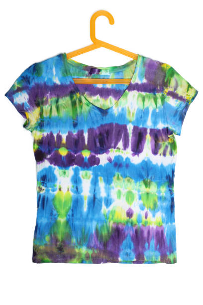 istock Colorful Tie Dye T-shirt on a hanger isolated on white 1306248986