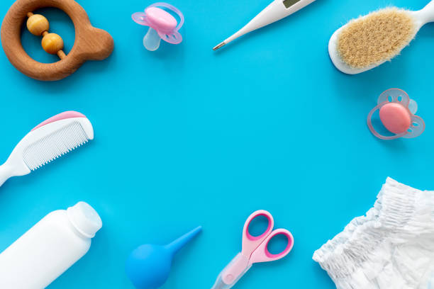 istock A set of accessories and cosmetics for baby hygiene, flat layout, top view, copy space for text. Hygiene products for newborn care on a blue background. Baby background 1306249948
