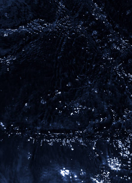 istock texture of water on black background, Water in night time 1306249971