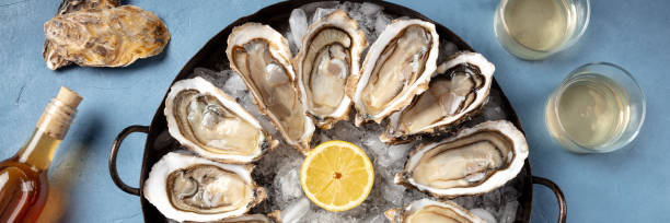 istock Oysters and wine panorama, top flat lay shot 1306250059