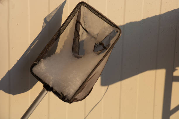 istock small landing net covered with snow lit by the cold winter sun 1306250883