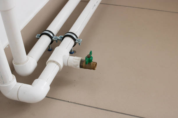 istock Pipes and radiator by the window closeup 1306251586