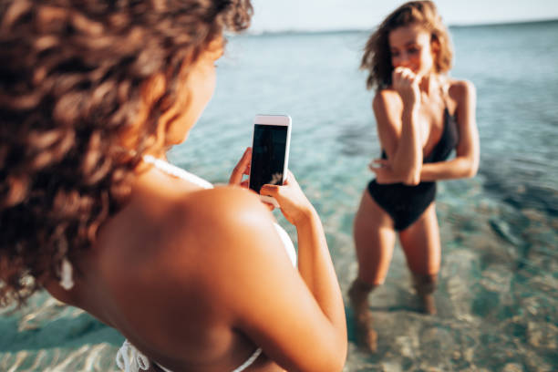 istock take a pic to a friend at the seaside 1306253754