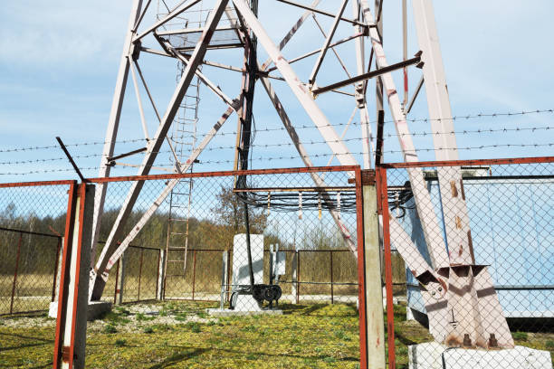 istock Security with barbed wire fence. 5G telecommunications tower security. 1306253990