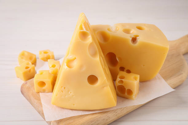 istock Tasty fresh cheese on white wooden table, closeup 1306255607