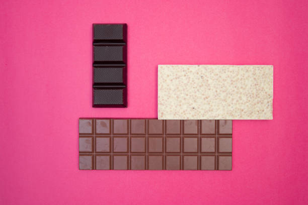 istock many, different, sweet, delicate chocolate bars on pink background 1306256020