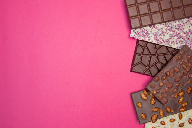 istock many, different, sweet, delicate chocolate bars on pink background 1306256682