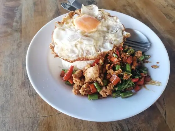 Photo of Stir fried Thai basil with minced pork and a fried egg