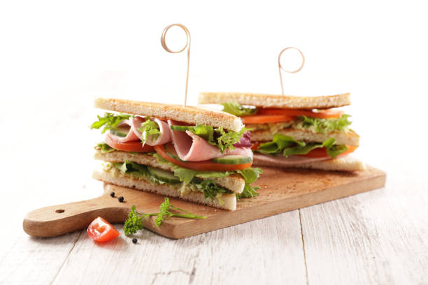 istock club sandwich with vegetable on board 1306260327