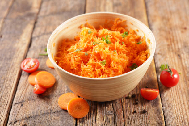 istock bowl with fresh grated carrot 1306260328