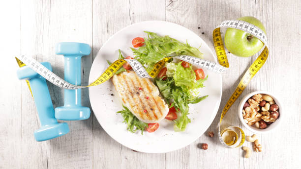 istock diet food concept- grilled chicken and lettuce 1306260363