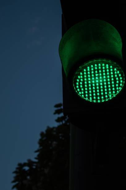 istock evening car traffic light night giving way to green light 1306261817