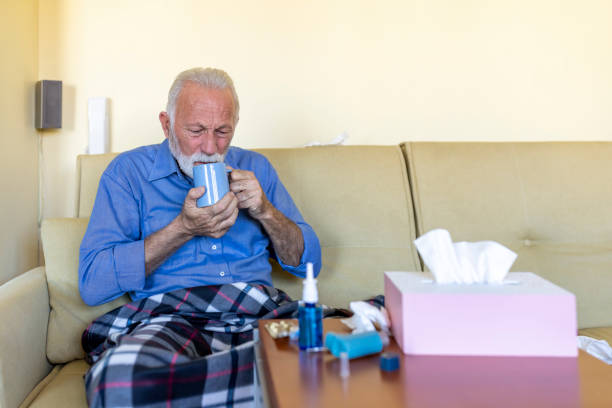 istock Sick Senior Man is Lying in the Bed Due to High Temperature. 1306265020