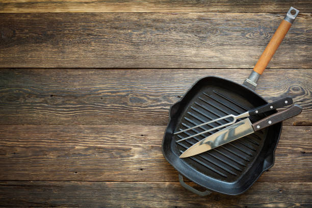 istock grill pan on wooden old background 1306266498