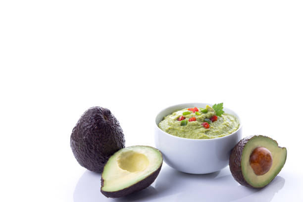 istock Guacamole bowl with avocados isolated on white background with copy space. 1306274256