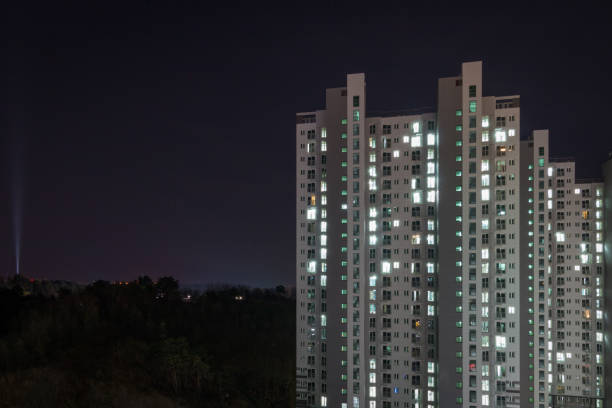 istock Illuminated apartment tower in South Korea at night 1306275675
