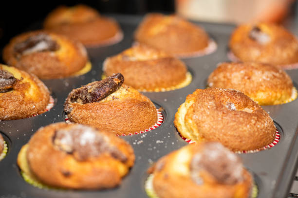 istock Pastry sweets. Homemade muffins with chocolate heart. Selective focus 1306277259