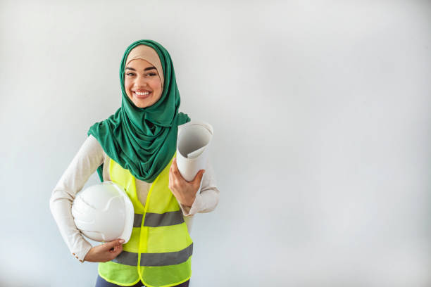 istock Female architect and engineer in hidjab and hardhat. 1306278593