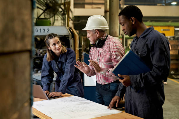 istock Metallurgical Engineer Discussing Plans With Colleagues 1306280468