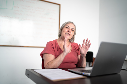 Teacher teaching on virtual class using laptop