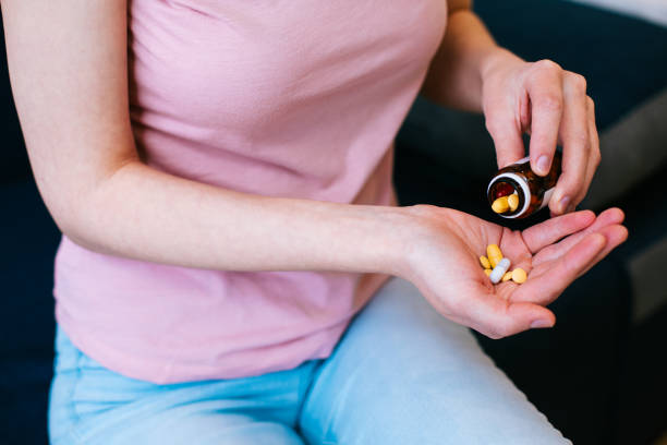 istock Person following the doctors instructions and taking medications 1306283293