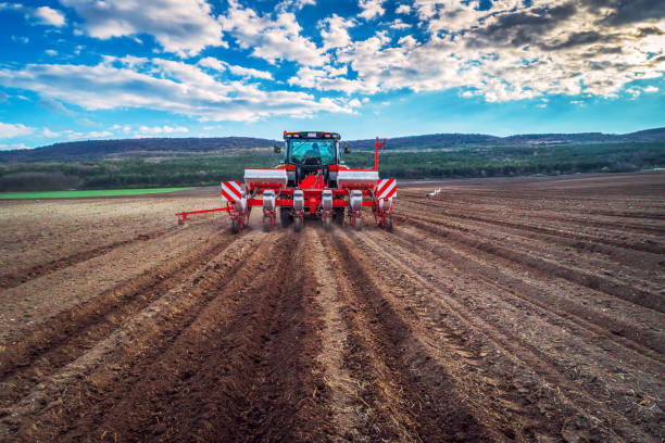 istock Farmer in tractor preparing farmland with seedbed for the next year 1306287578
