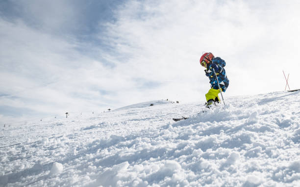 istock Little boy enjoying skiing on the mountain 1306287677