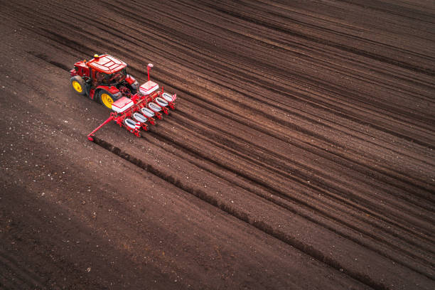 istock Farmer in tractor preparing farmland with seedbed for the next year 1306287725