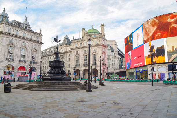Deserted Piccadilly Circus during lockdown, London London, United Kingdom - November 9 2020: Daytime view of an empty Piccadilly Circus during the coronavirus lockdown. soho billboard stock pictures, royalty-free photos & images