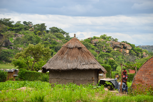 Rural Area, Zimbabwe - December 22 2018: A traditional hut with a thatched roof in a rural area of Zimbabwe