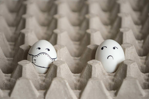 istock Easter eggs on quarantine. Social distance concept 1306293275
